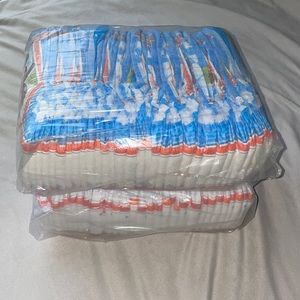 Two 34-count packs of pull-ups + 14 loose 4T-5T (82 total)